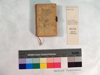 small book with cover of ivory